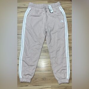 Adidas women’s Light Pink Joggers with White Stripes